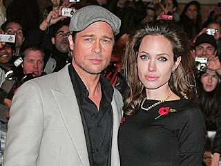 Brad Pitt Covers Angelina Jolie at Premiere (Correction)