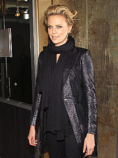 Charlize Theron Gets a Surprise from Jeremy Renner