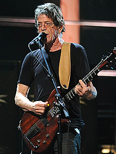 The Water Bowl: Dog Blown Off Roof, Survives! Plus, Lou Reed's Concert for Canine Ears