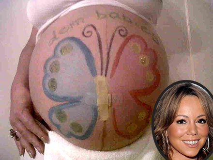 Mariah Carey Pregnant – and Decorates Her Baby Bump