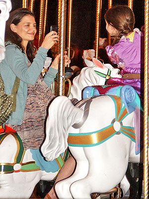 Katie Holmes & Suri Cruise Take Smiley Carousel Ride at Disney World