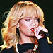 Rihanna Hits Fan with Microphone at Concert