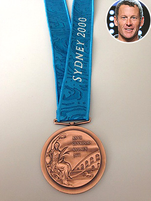 Lance Armstrong Returns His Olympic Medal