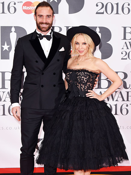 Brit Awards 2016: Kylie Minogue Walks Red Carpet with Joshua Sasse