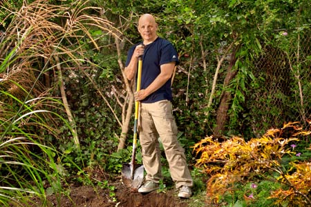 Scott Omelianuk digging in his backyard