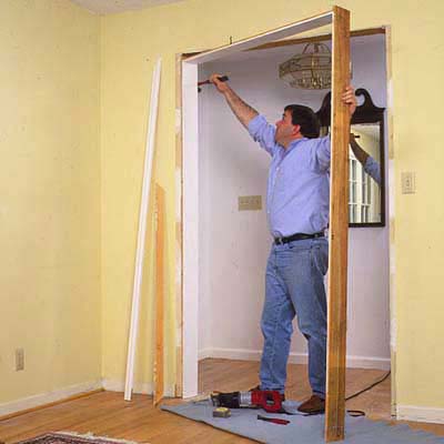 Use a claw hammer to pry the existing doorjambs from the opening