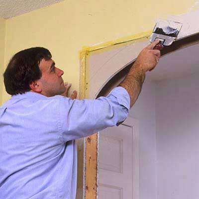 Conceal the new drywall patches with drywall tape and joint compound