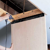 Mounting the door panel by attaching it to the opening with a drill/driver