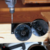 Install the spring drums for the pulley system that will allow staircase to slide down when attic door opens