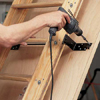 Attach stairs to door panel before enabling pulley system on attic stairs