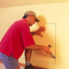 makring the outline of the dresser in the wall