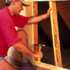 remove studs and insulation from inside the wall to make room for the dresser