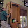 adhere a prefinished plywood skin to the sides of the cabinets 