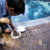 GETTING RID OF DEBRIS BY EMPTYING THE SKIMMER BASKET