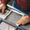 applying putty to exposed rabbets