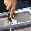 smoothing the putty witha putty knife
