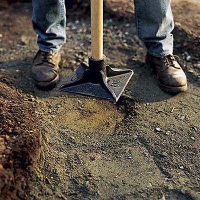 Compacting the stone base.
