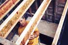 Tom Silva stiffening i-joists before installing a floor