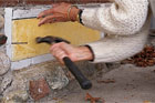 sealing up a crawl-space vent with rigid foam block