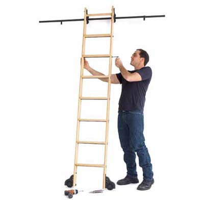 man building a library-style ladder