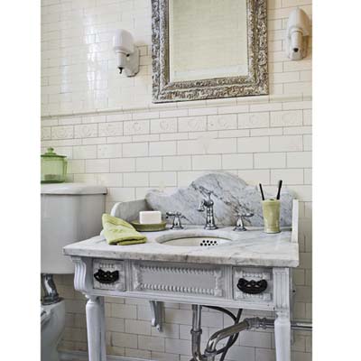 bathroom with marble sink, and glass shades