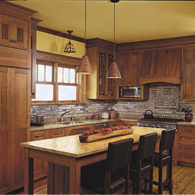 kitchen is completed with oak cabinets with matching panels 