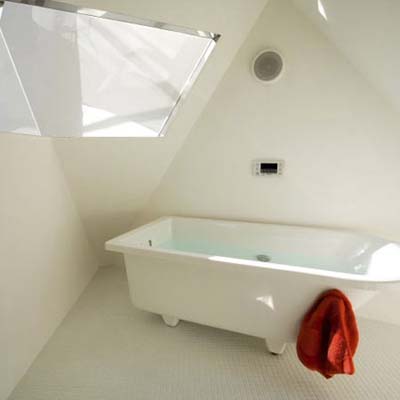 the angular walls of the Reflection of Mineral House bathroom in Tokyo