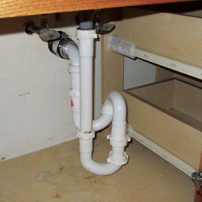 piping under the kitchen cabinets