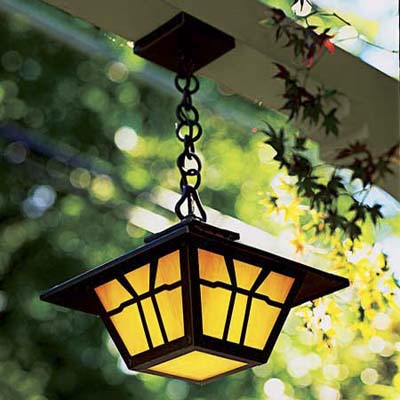 Bronze light fixture with amber glass shades