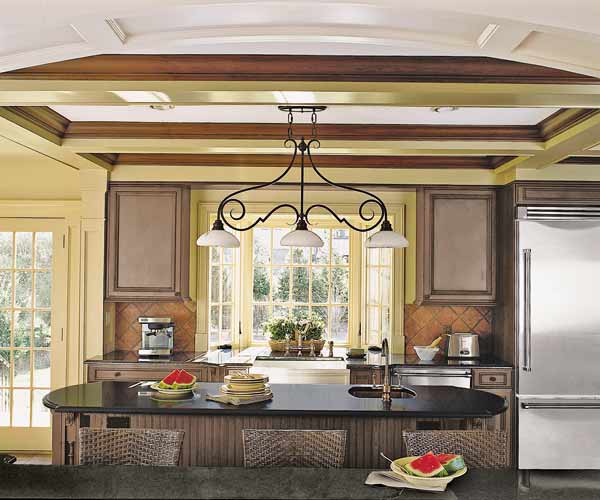 breakfast bar and island in Tudor Revival kitchen before and after
