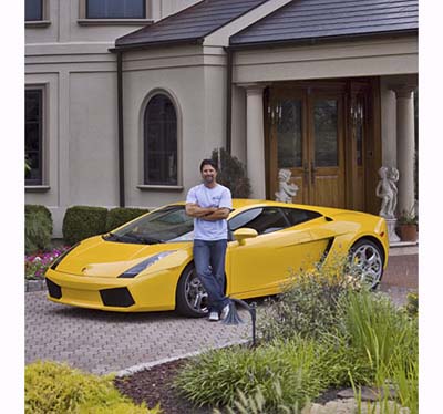 Michael Andretti at home with his Lamborghini