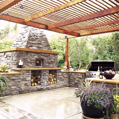 Pizza oven and pergola in outdoor kitchen