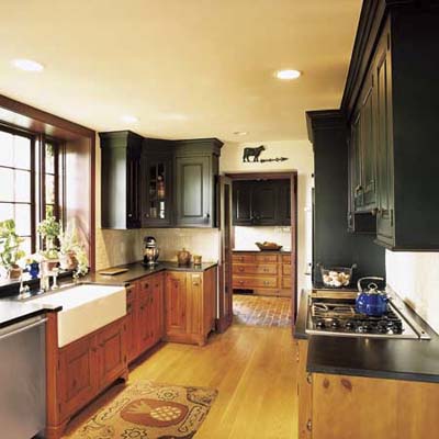 kitchen with pine and cherry cabinetry, new hardwood plank floor, honed black-granite countertops at Ravenroyd
