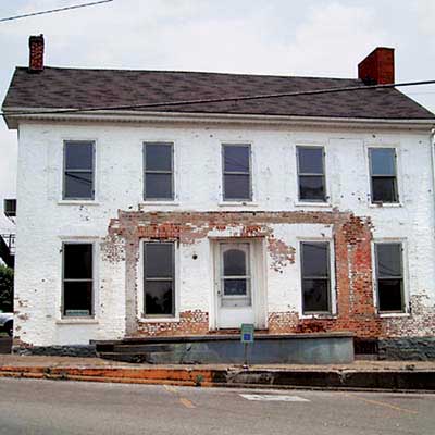federal style home before renovation