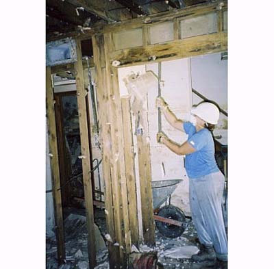 gutting a Katrina-damaged house in New Orleans