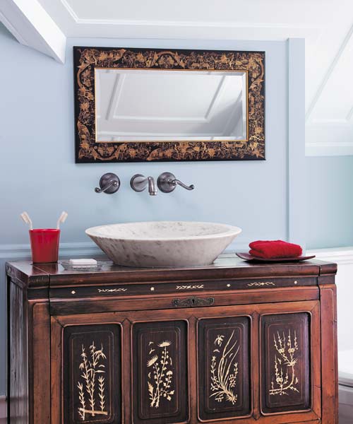 antique chest and a marble vessel sink