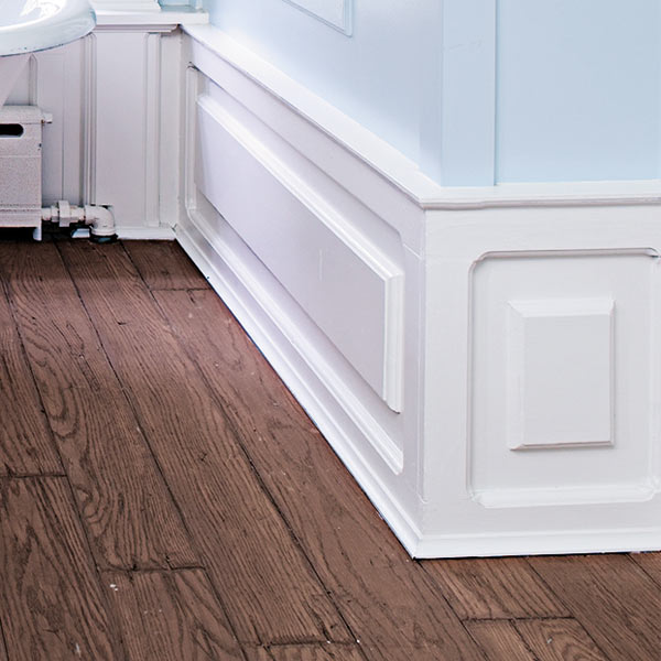 raised-panel baseboards with pilaster in attic bathroom remodel after