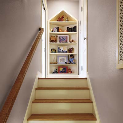 attic stairs leading to a built-in bookcase from a cottage remodel in Austin, TX
