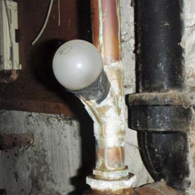 a light bulb used as a plumbing waste line cap