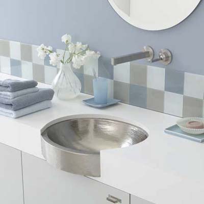 undermount sink from native trails has an apron front and is available in antique and brushed nickel finishes