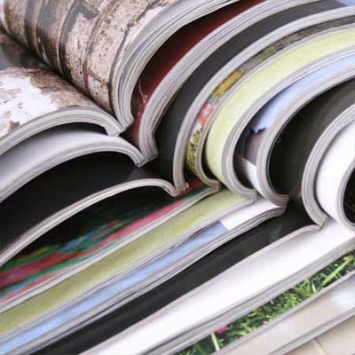 open magazines stacked binding to binding