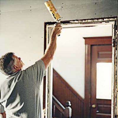 Tom Silva insulates at the East Boston TV Project from 2006