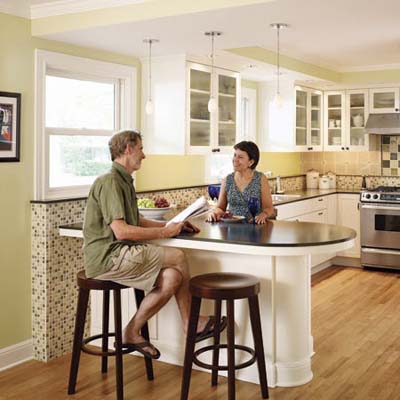 couple sits at their kitchen counter