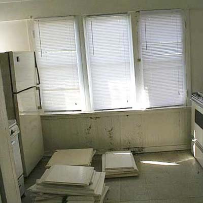 the sunroom before remodel when it was still one kitchen in the triplex