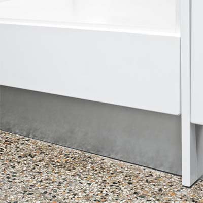 metal toekick installed at the bottom of a door