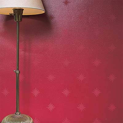 two-tone red wall with a painted star pattern