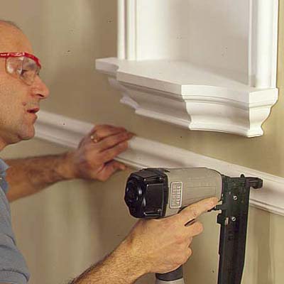 man installing a chair rail
