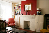 alex bandon's living room with built-in bookshelves and mantle
