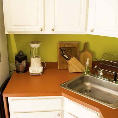 Cutting off the laminate counters created room for a full-sized refrigerator