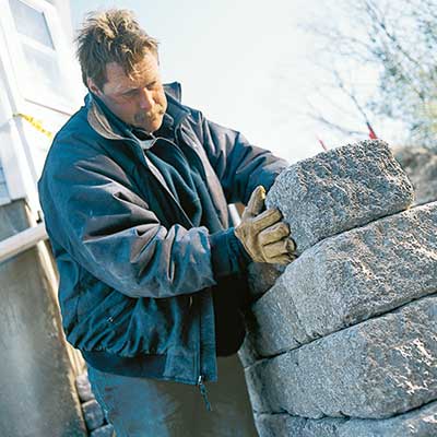 Roger Cook building a bluestone retaining wall